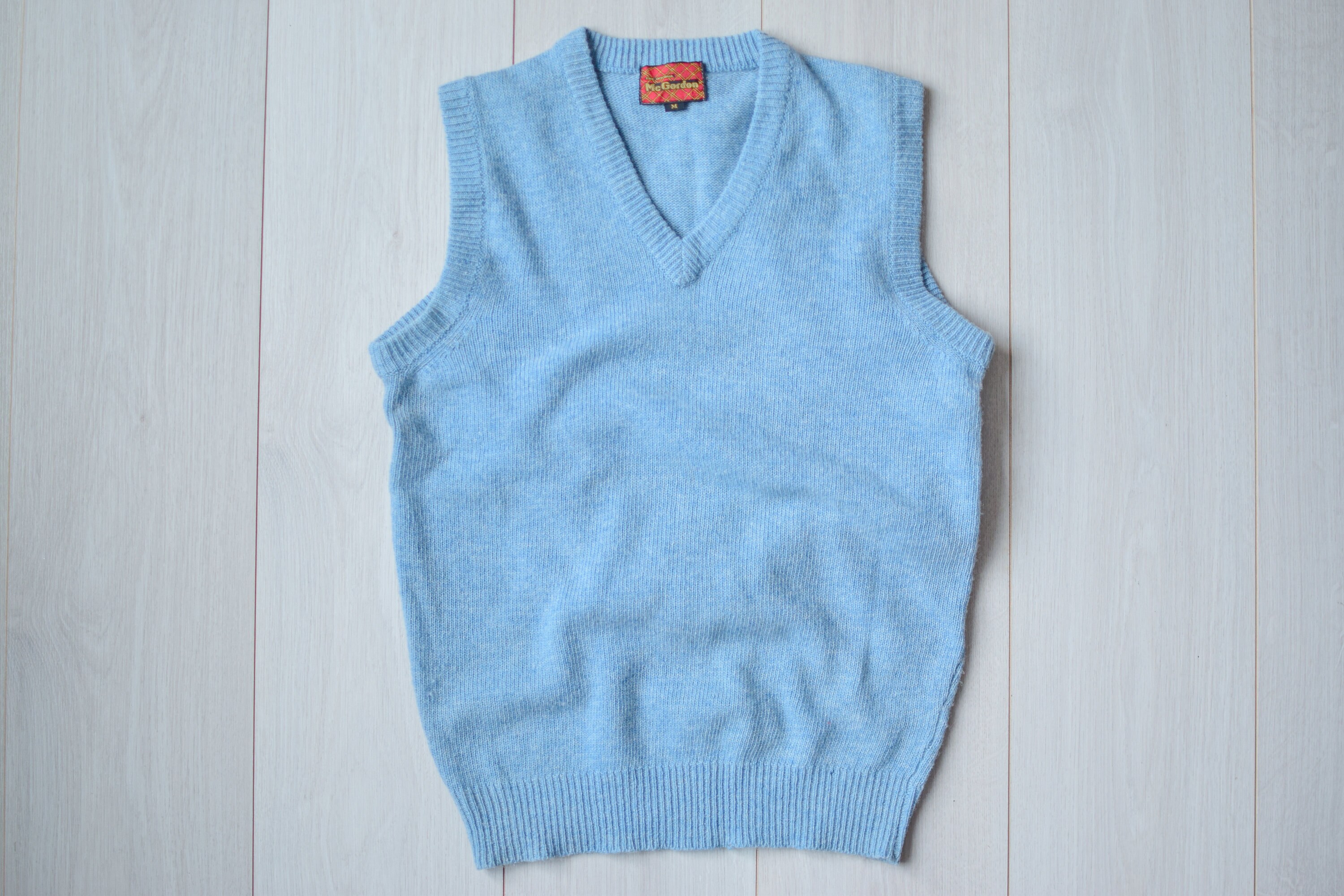 Light blue shop sweater vest