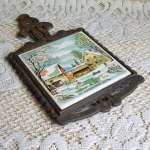 Enesco 9.25" Cast Iron The Farmer's Winter Homestead Ceramic Trivet