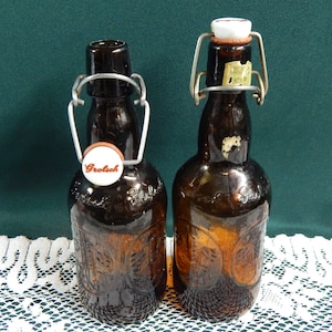 Grolsch Beer Bottles -Set of 2 -  Grolsch Lager Amber Embossed Bottles with  Porcelain Swing Top Stoppers