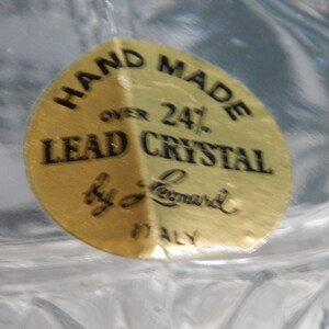 May include: A gold sticker with black text that reads "Hand Made Over 24% Lead Crystal by L. Leonard ITALY".
