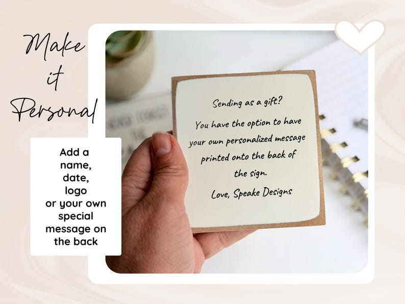 May include: A square wooden sign with a cream-coloured front featuring black text that reads: Sending as a gift? You have the option to have your own personalised message printed onto the back of the sign. Love, Speake Designs.
