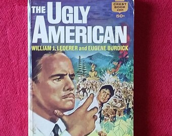 1963 - The Ugly American by William J. Lederer and Eugene Burdick - A Crest Book Fawcett Publications - 240 Pages -  Marlon Brando on Cover