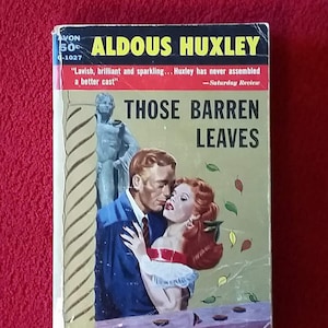 May include: A vintage paperback book cover featuring a couple embracing. The book is titled "Those Barren Leaves" by Aldous Huxley. The cover features a gold background with a quote from the Saturday Review.