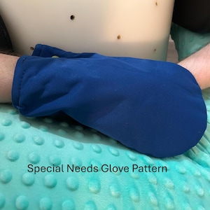 May include: A blue glove, designed for special needs, is shown on an arm. The glove is made of a soft material and is a solid blue color. The text "Special Needs Glove Pattern" is visible.