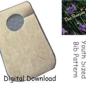 May include: A beige youth-sized bib pattern with a neck hole and a grid pattern. The pattern is a digital download and is from The Sleepie Bee.