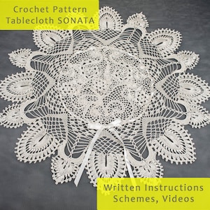 May include: A white crochet tablecloth pattern called "SONATA" with written instructions, schemes, and videos. The tablecloth is round and has a delicate, intricate design.