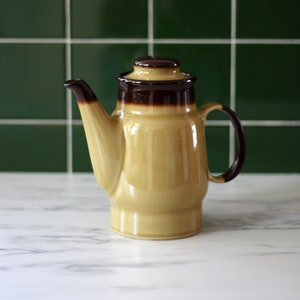 Vintage ceramic tea pot in mustard and brown