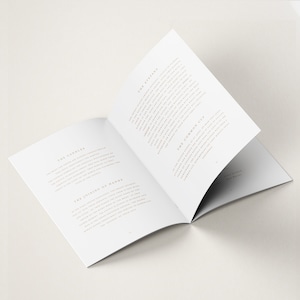 May include: An open book with white pages and gold text. The text on the left page reads "The Candle" and "The Joining of Hands". The text on the right page reads "The Readings" and "The Common Cup".