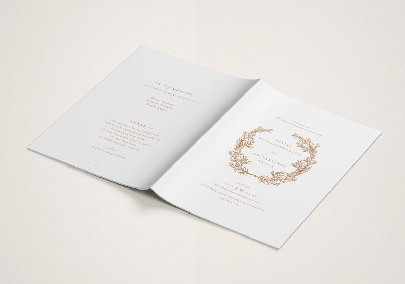 May include: A white wedding program with gold text and a floral wreath design. The program includes the names "Eirini Giannakopoulou" and "Agustinos Natzis" and the date "July 1st, 2023".