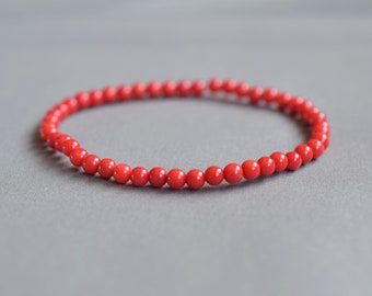 FAMA Red Coral Beaded Stretch Bracelet with Golden Paved Beads FAMA Red Coral Beaded Stretch Bracelet with Golden Paved Beads