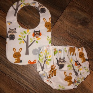 Forest Friends layette set featuring a diaper cover and reversible terry cloth and cotton Bib, baby shower gift