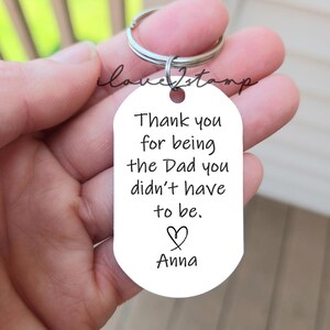 May include: Silver keychain with a white tag that reads "Thank you for being the Dad you didn't have to be. ♡ Anna"