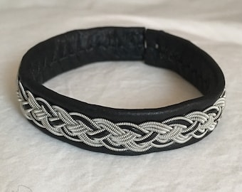 ERET - Nordic Sami inspired unisex bracelet of reindeer leather and pewter thread with 4% silver.