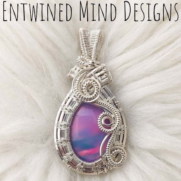 Aurora Opal wire wrapped pendant set in Sterling Silver.