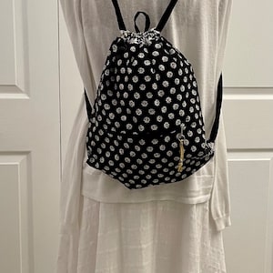 Drawstring Backpack. Cotton, lightweight, fully lined and great for travel and/or home use! Size 12”W x 14”H