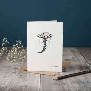 J is for Jellyfish! typographic jellyfish card, monochrome black and white card, pen and ink drawing, hand-drawn card