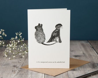 U is for Umbrella Bird and Unexpected Cotton Rat! typographic toucan card, monochrome black and white card, pen and ink illustration