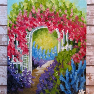 May include: A painting of a garden archway covered in pink flowers with a path leading through it. The path is lined with purple and blue flowers.