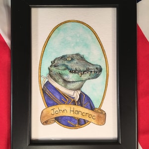 May include: A watercolor painting of a crocodile wearing a blue and gold jacket with a scroll that says "John Hancock".