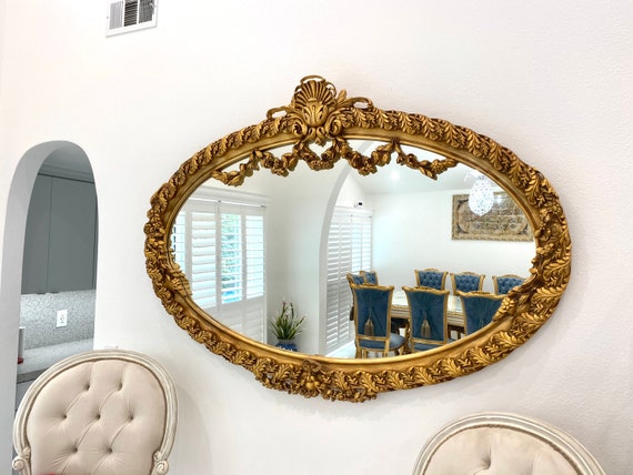 Ornately carved Gold mirror