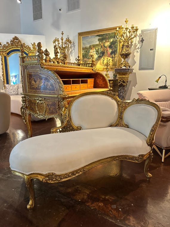 Louis XV French style chaise lounge in gold leaf