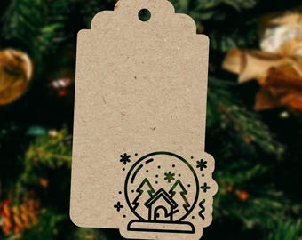 May include: A brown paper gift tag with a black and white illustration of a snow globe with a house and trees inside. The tag has a hole at the top for string.