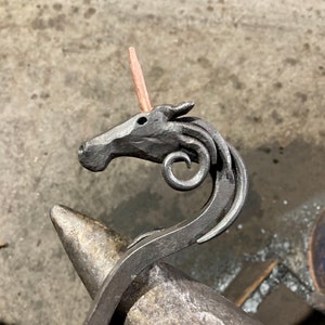 Hand forged unicorn fire poker