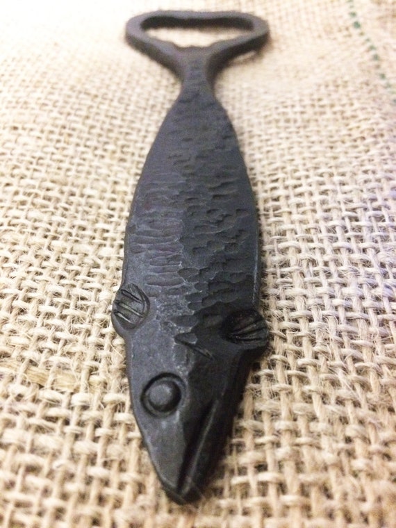 A blacksmith hand-hammered an actual fish shape into a functional bottle opener — 321 favorites don't lie, this thing is charming and one-of-a-kind.