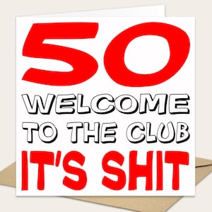 May include: A square greeting card with a white background featuring the large red number 50 at the top. Below this, the black text reads WELCOME TO THE CLUB. At the bottom, the red text reads IT'S SHIT. The card is positioned on a brown envelope.
