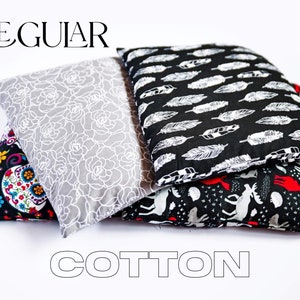 May include: Three cotton fabric pillow covers with different patterns. The first cover has a black background with colorful sugar skulls and flowers. The second cover has a gray background with a white floral pattern. The third cover has a black background with white feathers. The text "REGULAR" is at the top of the image and the text "COTTON" is at the bottom of the image.