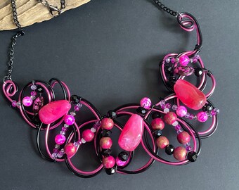 Big bold designer beaded twisted wire necklaces. Choice of colour.