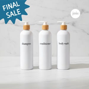May include: Three white shampoo, conditioner, and body wash bottles with bamboo-colored tops. The bottles have black text labels and are displayed on a white surface. The image includes a "FINAL SALE" graphic.