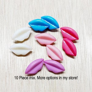 May include: A set of three ceramic mugs with a speckled, matte finish. Each mug features a different color: light blue, cream, and gray. The mugs have a simple, modern design, perfect for coffee or tea.