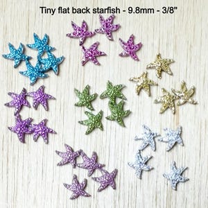May include: A collection of tiny, flat-backed starfish in various colors, including blue, purple, green, and gold. The text "Tiny flat back starfish - 9.8mm - 3/8" is visible. These decorative embellishments are ideal for craft projects.