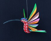 Beautiful oaxacan wood carving hanging hummingbird alebrije. Mexican folk art