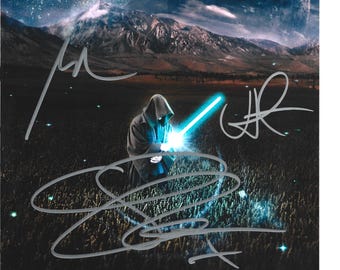 May include: A movie poster for Episode VII, featuring a hooded figure with a glowing blue lightsaber. The background shows a starry sky, planets, and mountains. The poster includes the text "Episode VII" and "Return to a Galaxy Far, Far Away", along with several signatures.