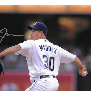 Superstar Hall of Fame Pitcher GREG MADDUX Autographed 8x10 Game Day Photograph