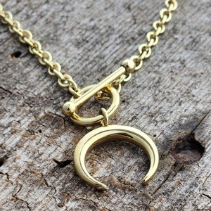 Collier à bascule en croissant de lune