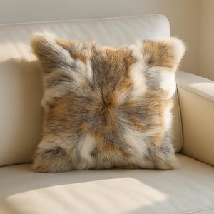 May include: A soft, fluffy pillow with a brown and white fur pattern. The pillow is made of real fur and has a luxurious feel.
