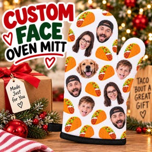 May include: A white oven mitt featuring a repeating pattern of various human faces, a dog face, and orange taco illustrations. The mitt has a black trim at the bottom opening. The design includes diverse expressions and individuals with and without glasses.