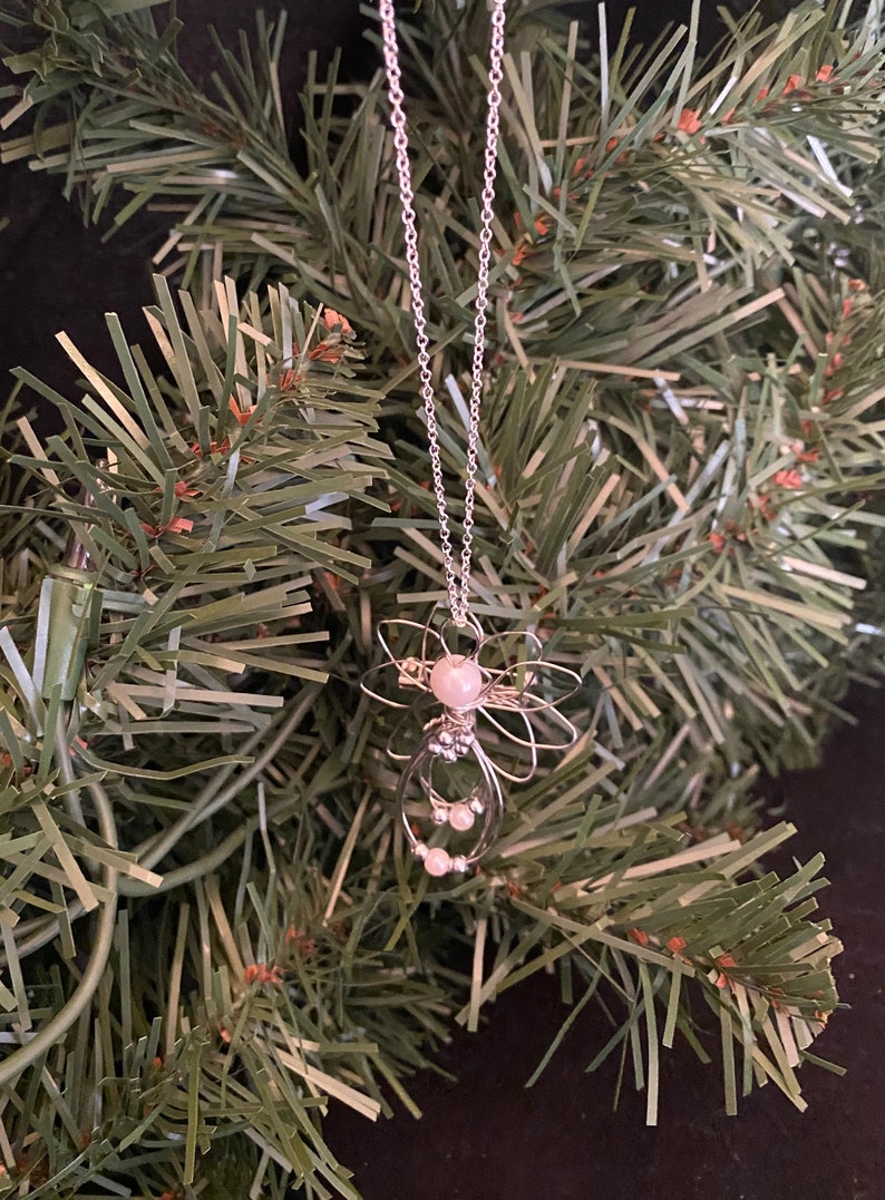 1.5-inch Handcrafted Silver Wire Angel Necklace - accented with silver and white beads. Elegant Heavenly Charm - Unique Gift for Her on a tree.
