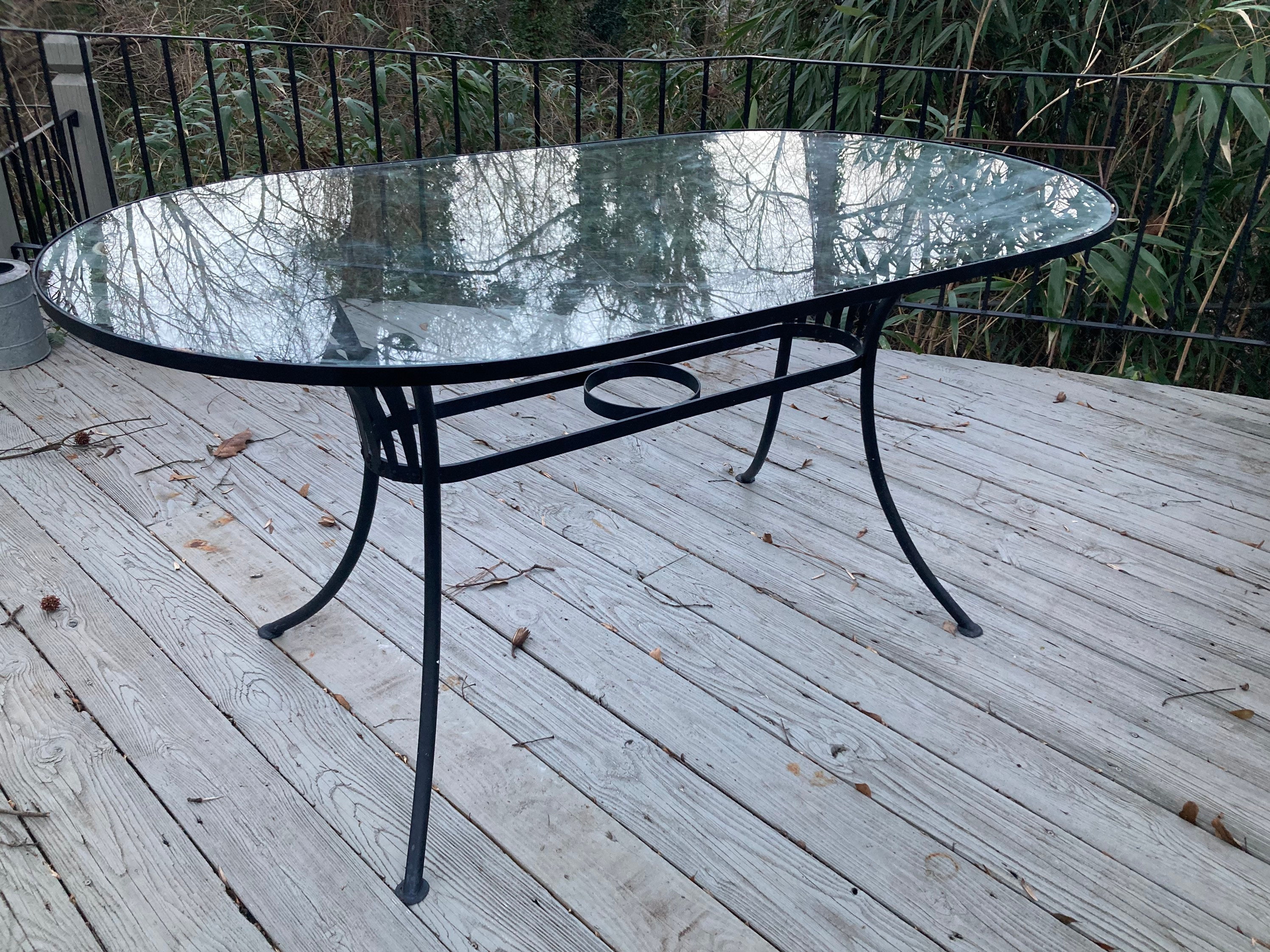 Oval glass 2024 patio table