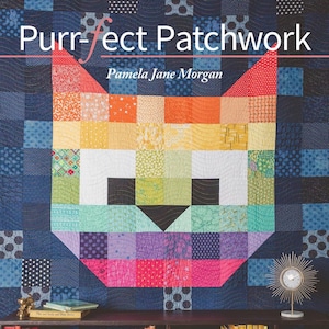 May include: A book cover with a colorful patchwork cat design. The title is "Purr-fect Patchwork" by Pamela Jane Morgan. The subtitle is "16 Appliqué, Embroidery & Quilt Projects for Modern Cat People".