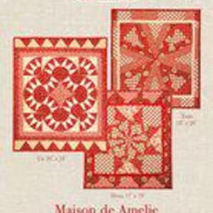 May include: A pattern booklet titled Maison de Amelie by French General featuring three red and cream quilt designs. The cover displays the text French General, Maison de Amelie, and Using French General's La Vie en Rouge Collection with dimensions 18 x 24, 15 x 18, and 15 x 18 inches.