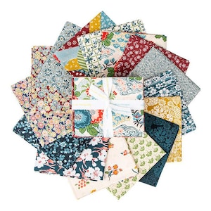 May include: A set of 16 fabric squares featuring a variety of Japanese-inspired patterns in shades of blue, green, red, and white. The fabric squares are arranged in a circular pattern and tied together with a white ribbon.