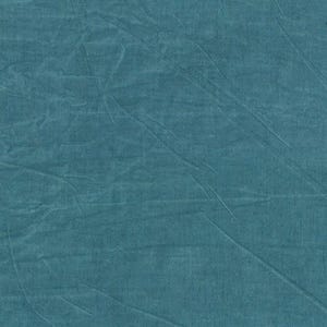 May include: A close-up of a teal-colored fabric with a textured surface. The fabric has subtle wrinkles and folds, creating a sense of depth and visual interest. The color is a muted, cool tone, suitable for various textile applications.