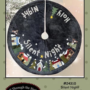 May include: A dark gray Christmas tree skirt with the words "Silent Night" and "Holy Night" in white. The skirt features appliqued houses, trees, and stars. The finished size is a 40-inch circle.
