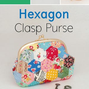 May include: A colorful hexagon-shaped fabric purse with a gold clasp. The purse is made of patchwork fabric with a variety of floral prints. The purse is closed and sitting on a white surface with two keys next to it. The text "Hexagon Clasp Purse" is written in blue letters above the purse. The text "Designed by Kristyne Czepuryk of Pretty by Hand" is written below the purse. The text "HARDWARE INCLUDED" is written in white letters on a pink background below the keys.
