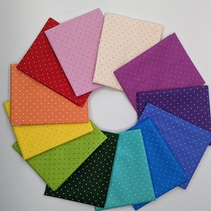 May include: A set of ten fabric squares with white polka dots on a variety of colored backgrounds, including red, orange, yellow, green, blue, purple, and pink.