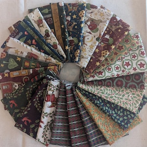 May include: A collection of 20 fabric squares featuring a variety of Christmas-themed patterns. The patterns include red and green plaid, holly, stars, and reindeer. The fabrics are all cotton and are perfect for quilting, sewing, or crafting.